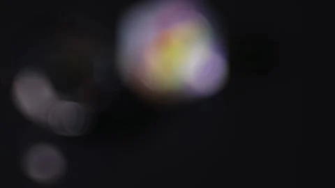 Rotating cubic and circular bokeh lights on a black background for digital .. 스톡 동영상 341736891
