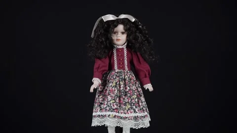 Rotating Curly Black Haired Doll On Black Background. Stock Footage 290391037