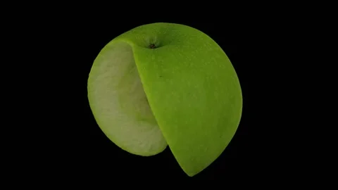 Rotating Cut Green Apple on Black Background (Looping) Stock Footage 146618878