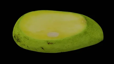 Rotating Cut Green Ivory Mango on Black Background (Looping) Stock Footage 149346647
