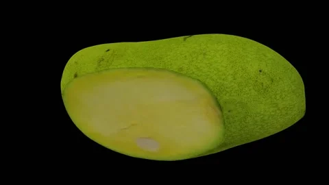 Rotating Cut Green Ivory Mango on Black Background (Looping) Stock Footage 149346897