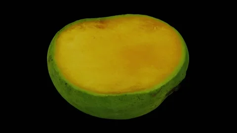 Rotating Cut Green Mango on Black Background (Looping) Stock Footage 146817762