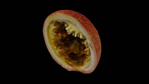 Rotating Cut Passion Fruit on Black Background (Looping) Stock Footage 146822567