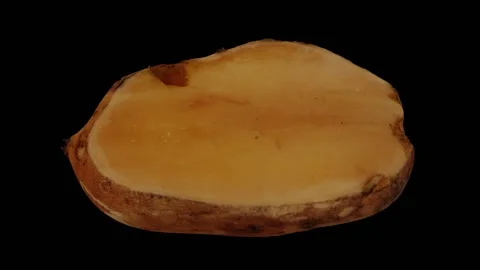 Rotating Cut Yacon on Black Background (Looping) Stock Footage 149446893