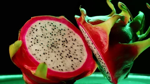 Rotating cutting into two pieces dragon fruit Video stock 234092609