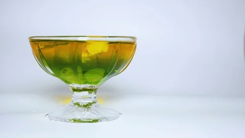Rotating dessert gelatin multicolour on white background uhd Stock Footage 82745381