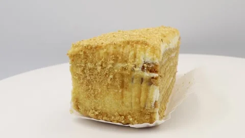 Rotating detailed view of a cake slice. Ideal for sweet treats Stock Footage 296825370