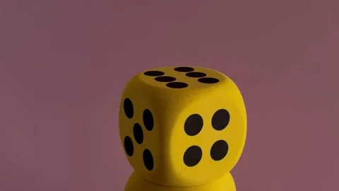 Rotating Dice Concept for Luck, Chance, Risk, and Probability Stockbeeldmateriaal 332992034