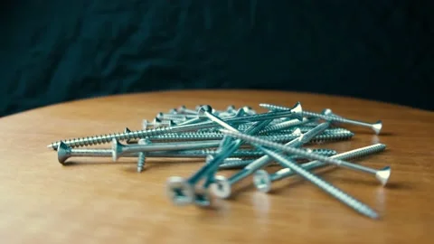 Rotating different sizes of flat head Screws Stock Footage 169291505