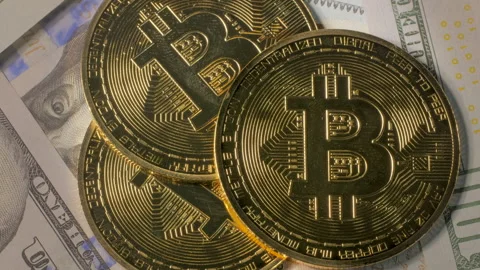 Rotating digital currency coins placed on international paper money Stock Footage 334862527