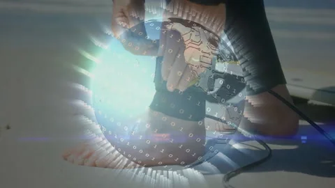 Rotating digital globe over barefoot initiating hand gripping strap threading Stock Footage 311083253