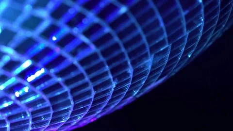 Rotating disco ball, extreme close-up. A mirrored disco ball in close-up ro.. Stock Footage 265759309