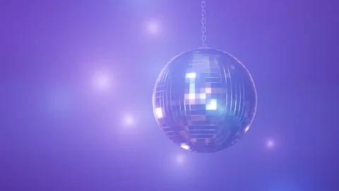 Rotating disco ball hanging from chain with purple lighting Stock Footage 288981730