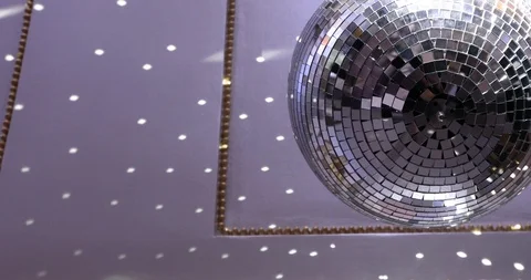 Rotating Disco Ball With Sparkling Rays And Reflection Stock-Footage 124282159