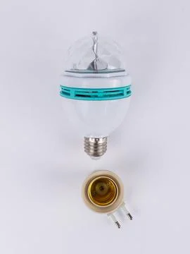 Rotating disco led bulb with brass socket angled Stock Photos