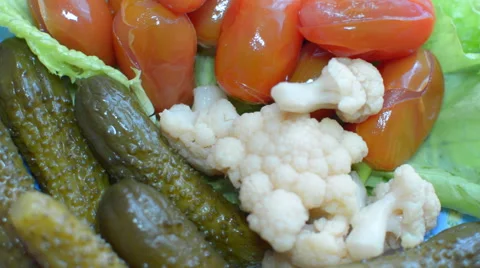 Rotating Dish of Pickled Cucumbers, Tomatoes and Seaweed Stock Footage 61802536