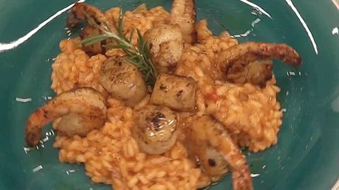 Rotating dish with risotto overhead Stock Footage 112128147