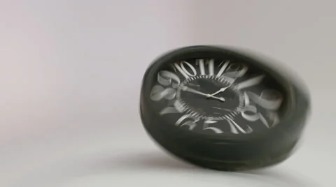 Rotating distorted clock fall to the floor.  Stock Footage 59720344