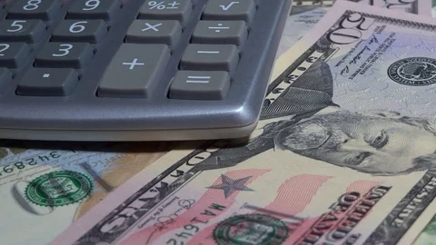 Rotating Dollars Bills And Calculator Stock Footage 72434529