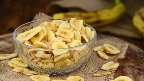 Rotating Dried Banana pieces (4K, seamless loopable) Stock Footage