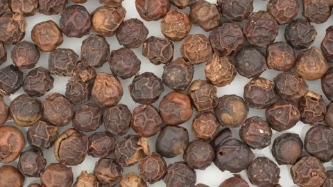 Rotating Dried Black Peppercorns Macro Texture Background Video stock 331115853