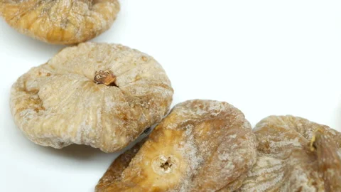 Rotating dried Figs on white background in right side Stock Footage 87748175