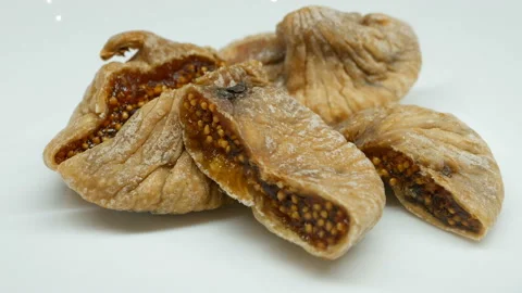 Rotating dried Figs on white background in right side Stock Footage 87748634