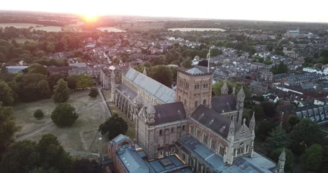 Rotating drone shot around St Albans Cathedral during a summer sunset Stock Footage 210863727