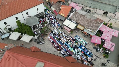 Rotating Drone Shot of Many Men Perform Salaat Outside on the Prayerrugs Stock Footage 214313125