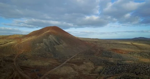 Rotating drone shot of volcanic mountain in Fuerteventura. Stock Footage 105064272