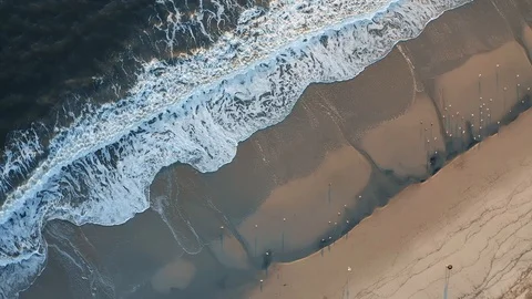 Rotating Drone Top View Of Crashing Ocean Waves And Sandy Beach LA Stock Footage 122301283