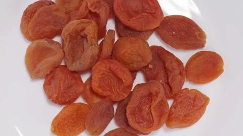 Rotating dry dried apricots close-up Stock Footage 146706302