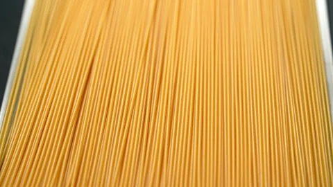 Rotating Dry Spaghetti Pasta Macro Shot Video stock 345599477