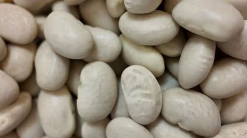 Rotating dry white beans macro close up slow motion Stock Footage 345164001