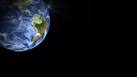 Rotating Earth View from Space with Sunlight Glare and Black Background. Stock Footage 310772647