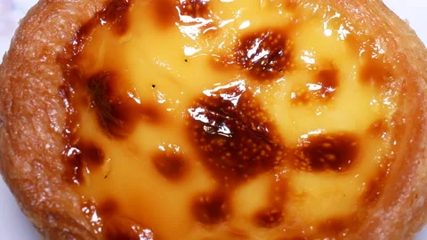 Rotating of egg tart on plate with 4k resolution Stock Footage 100309066