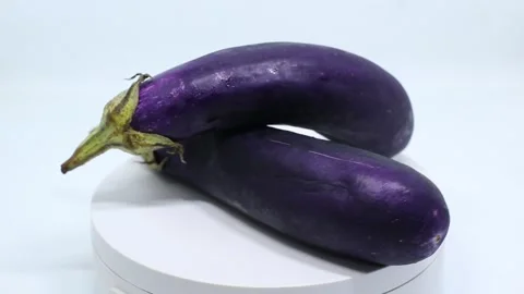 Rotating eggplant fruit on white background Stock Footage 222802173