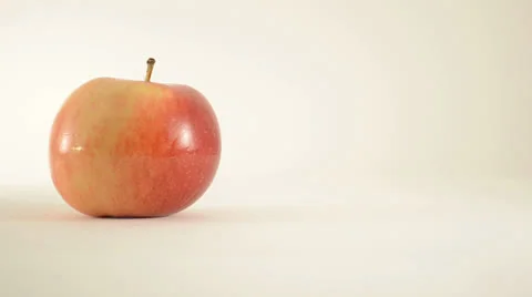Rotating Empire Apple Against White - Dolly Right Stock Footage 24471167