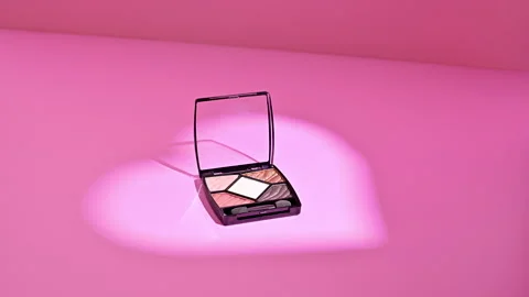 Rotating Eye Shadow Palette in Heart Glow Light. Stop motion Stock Footage 258258445