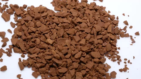 Rotating of falling instant coffee on white background with 4k resolution. Video stock 99272682