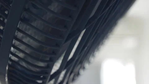 Rotating Fan Creating a Cooling Breeze Vídeo Stock 312110055