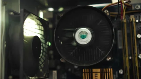 A rotating fan inside the system unit of a personal computer Stock Footage 213724775