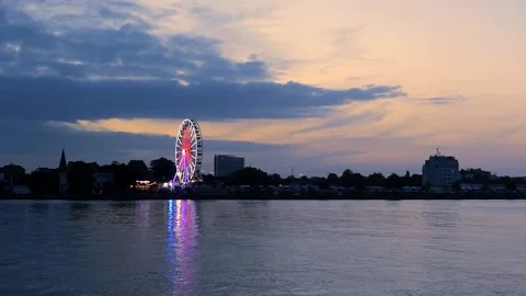 Rotating Ferris Wheel at the harbor Rostock at night - real time Stock Footage 140486751