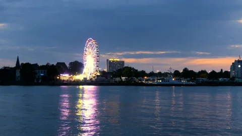 Rotating Ferris Wheel at the harbor Rostock at night - real time Stock Footage 140499587
