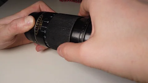 Rotating focus ring of old dusty and dirty metallic photo lens. Stock-Footage 105616598