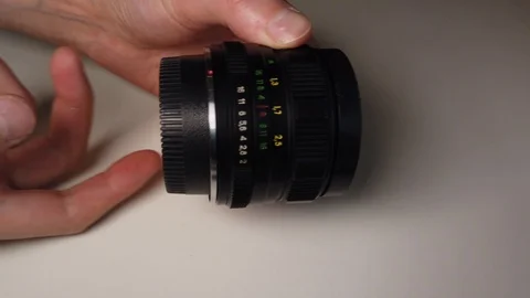 Rotating focus ring of old dusty and dirty metallic photo lens. Stock Footage 105621184