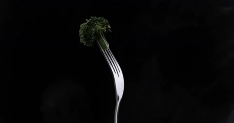 Rotating fork with cabbage on black background Stock Footage 144828499