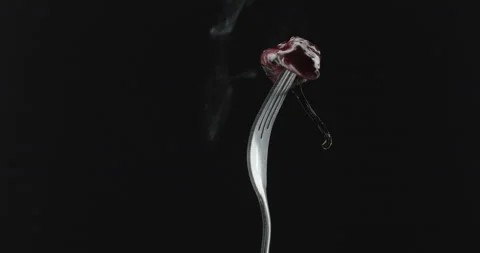 Rotating fork with pepper on black background Video stock 144629000