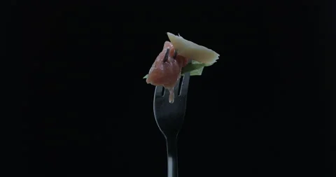 Rotating fork with salmon, cheese and cabbage on black background 스톡 동영상 145019788