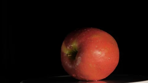 Rotating fresh apple in a black background Stock Footage 113909166